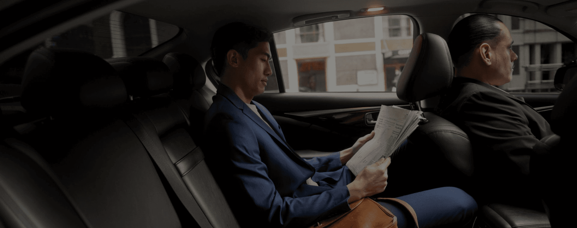 Luxury sedan and chauffeur